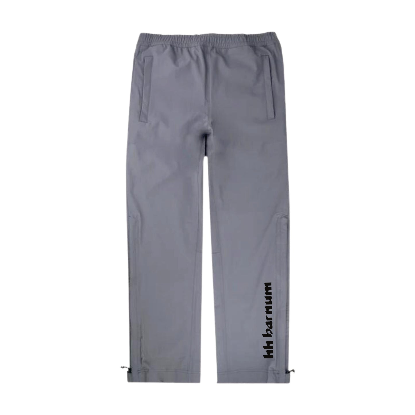 Gray pants with side pockets and a black logo on the leg
