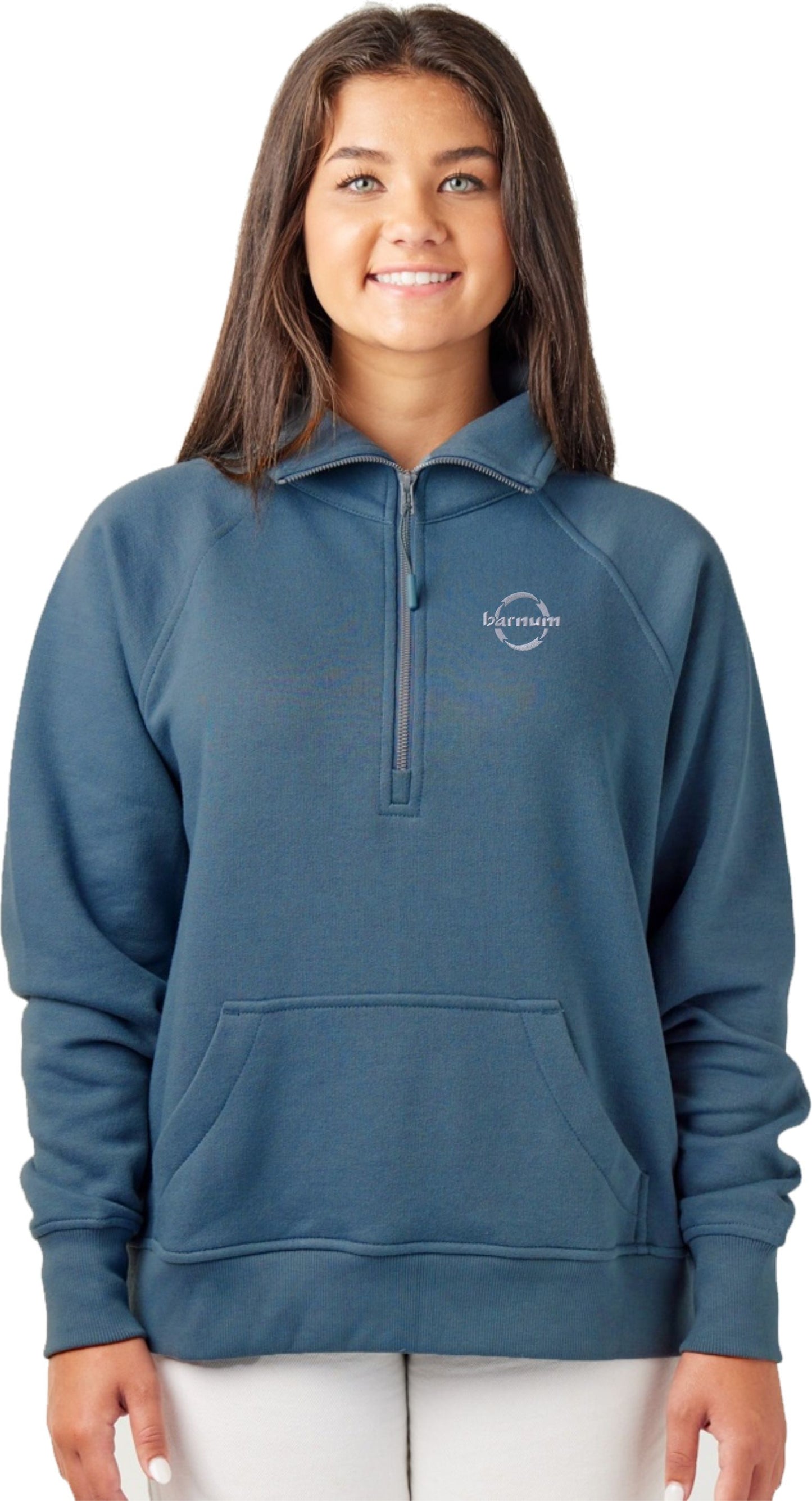 A young woman wearing a blue zip-up sweatshirt with a front pocket and logo.