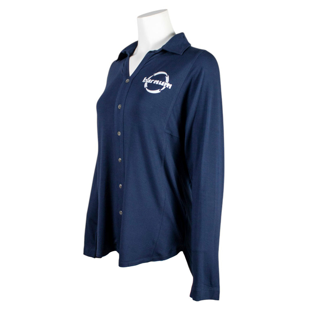 Side of a navy-blue tunic with a white barnum logo on the chest.