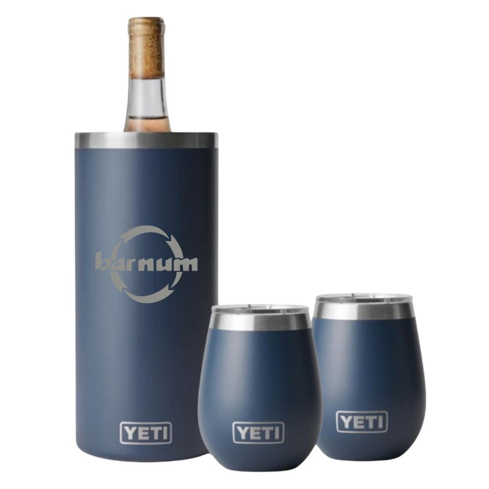 YETI branded wine bottle cooler and tumblers in a navy blue colorway, with the barnum logo engraved on them.