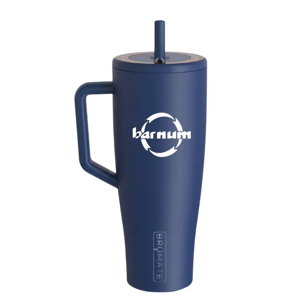 Navy travel mug with a handle and straw lid, with a white barnum logo on the side.