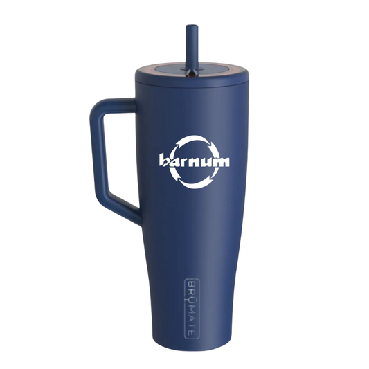 Navy travel mug with a handle and straw lid, with a white barnum logo on the side.