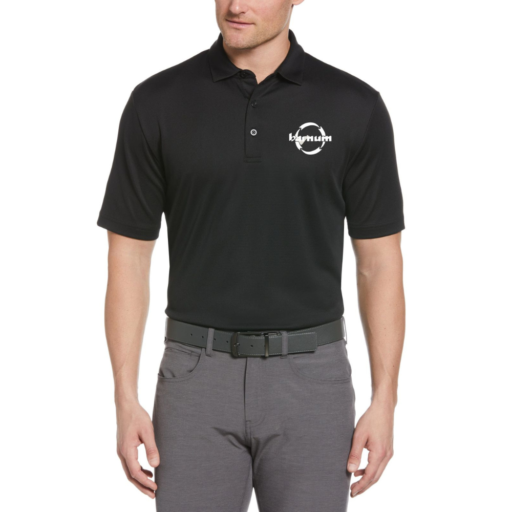 Man wearing a black polo shirt with a white barnum logo on the chest.