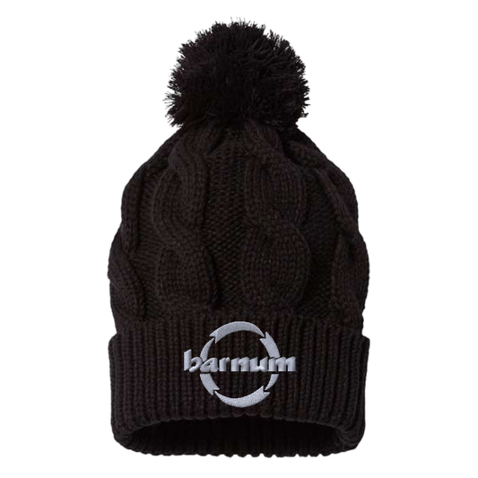 Black knit beanie with a pom-pom and 'barnum' logo sewn on the cuff. 