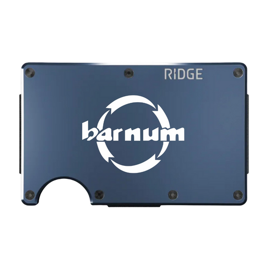 Blue metal wallet with 'barnum' logo across it in white.