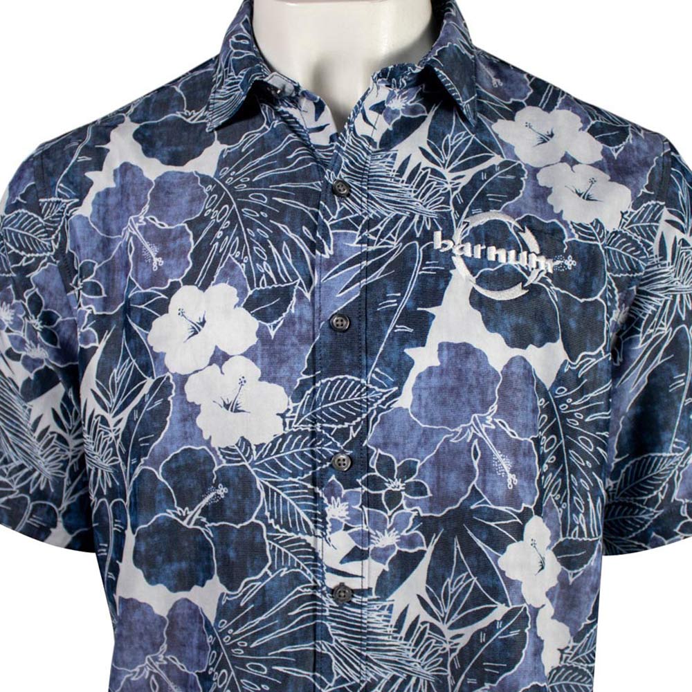 close up of chest of blue floral button up with the HH Barnum logo.