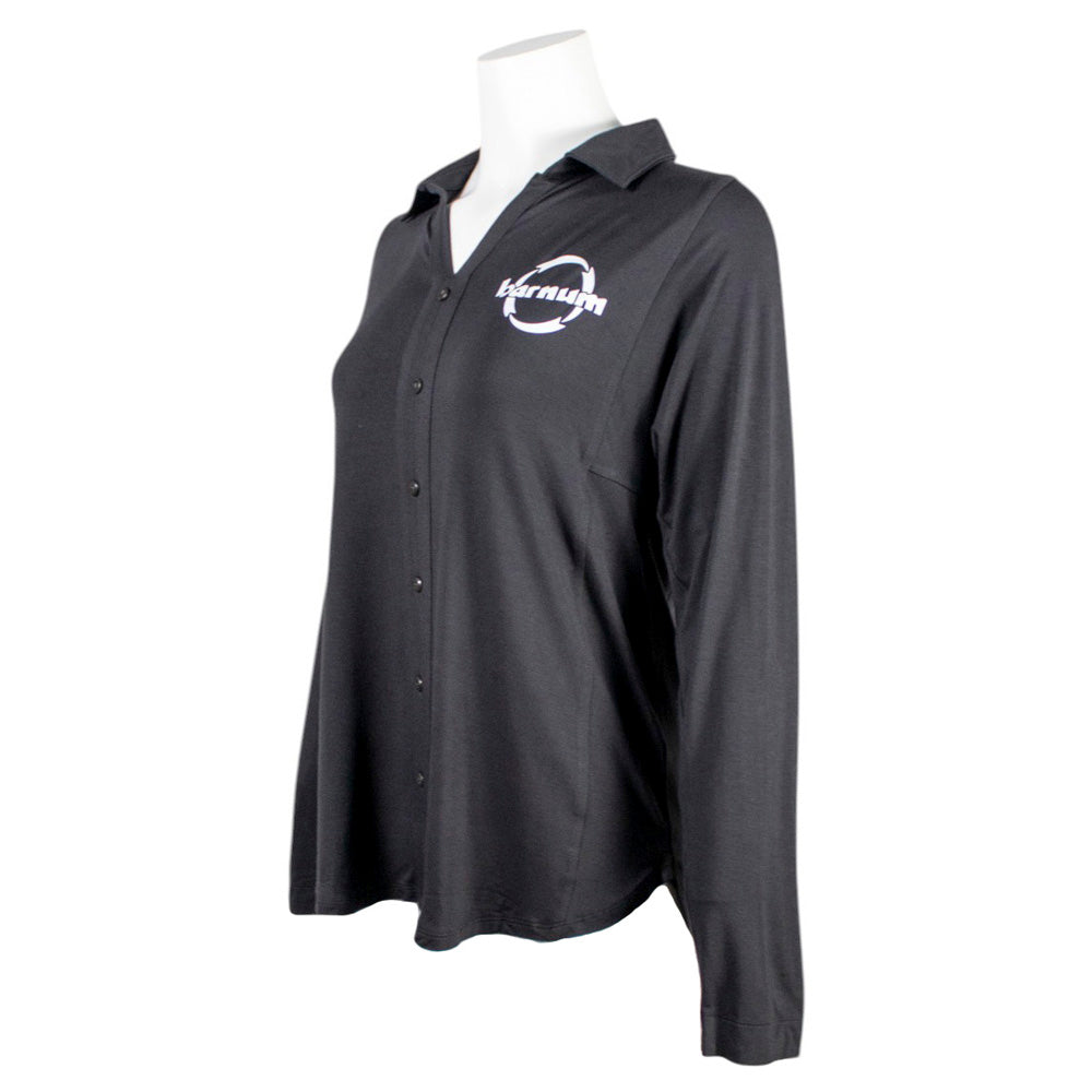 Side of a black button-up long sleeve with a white barnum logo on the chest. 